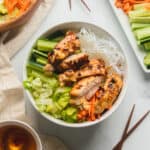 Vermicelli bowl with lemongrass chicken and other toppings and nuoc cham on the side.