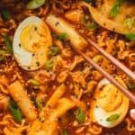 Panful of Rabokki with ramen noodles, rice cakes, and hard-boiled eggs.