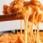 Spoonful of gooey melty kimchi mac and cheese.