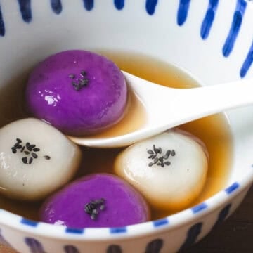 White and blue striped bowl and black sesame tangyuan.