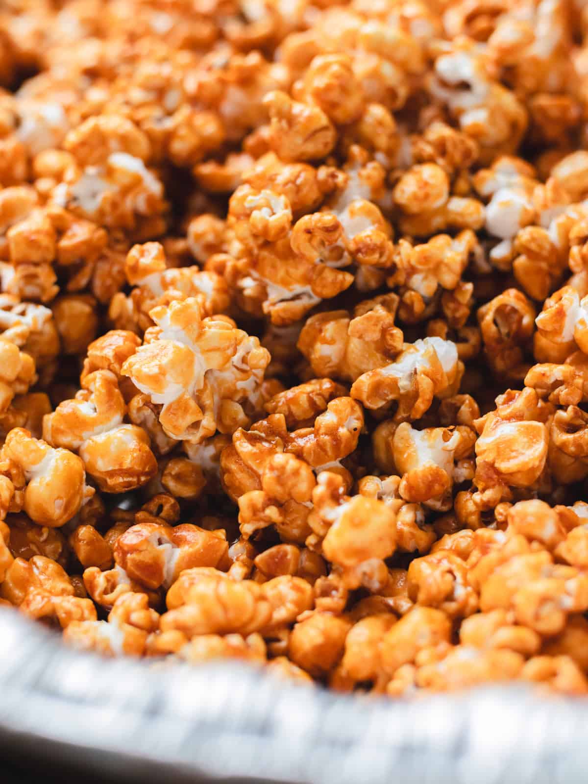 Homemade miso caramel popcorn in a turkey tray.